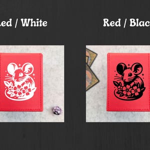 May include: Red card holder with a white mouse and flower design. The text "Red / White" is at the top. A second red card holder has a black mouse and flower design. The text "Red / Black" is at the top.