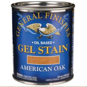 May include: A blue can of General Finishes Gel Stain in American Oak. The can features an eagle with a blue ribbon and the text "Oil Based".
