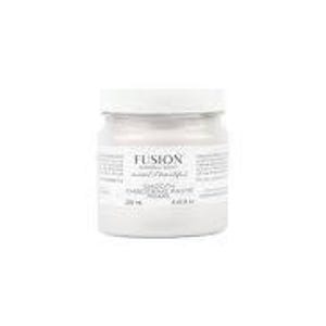 May include: A small, clear glass jar with a white lid, filled with a light-colored paint. The jar has a label with text, including the brand name "FUSION" and the paint color "Casement". The jar contains 8.45 fl oz of paint.