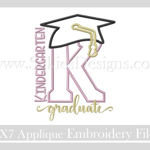 May include: A pink and gold embroidery design of a graduation cap with the letter K and the word "kindergarten" written vertically beside it. The word "graduate" is written in a cursive font below the letter K. The design is for a 5x7 applique embroidery file.