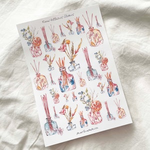 May include: A sheet of floral diffuser stickers with watercolor illustrations of glass bottles with flowers and sticks. The stickers are labeled "Floral Diffusers Stickers" and "Peartepaperie".