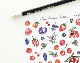 May include: A sheet of stickers featuring watercolor illustrations of various berries, including strawberries, blueberries, raspberries, cherries, and cranberries. The stickers are arranged in a grid pattern on a white background. The text "Sweet Berries Stickers" and "Pear Tea Paperie" is printed at the top of the sheet.