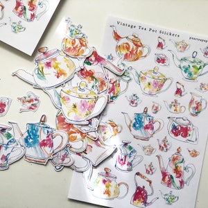 May include: A sheet of vintage tea pot stickers featuring colorful illustrations of teapots in various styles. The stickers are perfect for adding a touch of whimsy to journals, planners, or any other creative project.