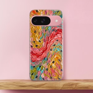 May include: A smartphone case featuring a thick, textured impasto oil painting design with swirling strokes of red, yellow, orange, teal, and pink. The case has a horizontal camera cutout bar at the top with a light pink frame and black lenses.