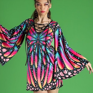 May include: A short, black dress with a butterfly print in shades of pink, blue, and yellow. The dress has long, wide sleeves and a lace-up neckline.