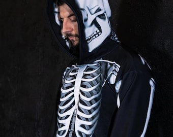 May include: A black hoodie with a white skeleton print. The hood has a skull design on the back.