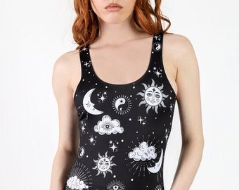 May include: A black one-piece swimsuit with a white celestial print featuring moons, stars, suns, and clouds.