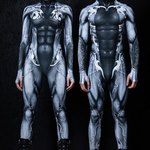 May include: Two people wearing black and white printed full-body suits with a muscular design. The suits have a white pattern of stylized lines and shapes. Both people are wearing black boots.