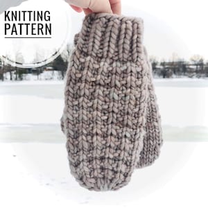 May include: A pair of knitted mittens in a light brown and white color with a cable knit pattern. The mittens are held in a hand against a snowy background.
