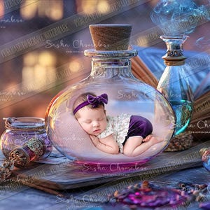 May include: A sleeping baby girl inside a large glass bottle with a purple bow in her hair. The bottle is on a wooden table with other glass bottles and a book.