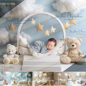 May include: A newborn baby sleeping in a white and blue baby crib set with a white teddy bear and a brown teddy bear. The crib is decorated with white clouds and stars.