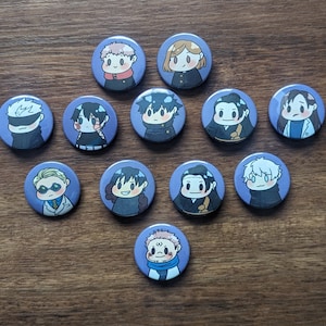 May include: A collection of twelve round, purple anime character buttons. Each button features a different character illustration with varying hair colors and outfits. The buttons are arranged on a wooden surface.