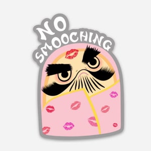 May include: A pink and yellow cartoon character with a mustache and eyebrows, wearing a pink blanket with pink lips printed on it. The character has a stern expression and the text "NO SMOOCHING" is written above the character.