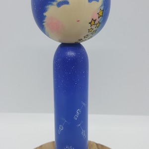 A Handmade hand-lathed hand-painted wooden creative Kokeshi doll.