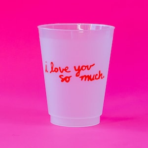 May include: A frosted plastic cup with the words "I love you so much." written in red on the side.