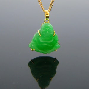May include: A green jade pendant of a smiling Buddha, set in gold, on a gold chain.