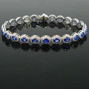 Sapphires and Diamonds Riviere Bracelet, 18kt white gold