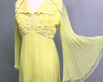 Incredible 1960s Bright yellow chiffon pleated dress with bell sleeves and applique flowers / 1960s gown /