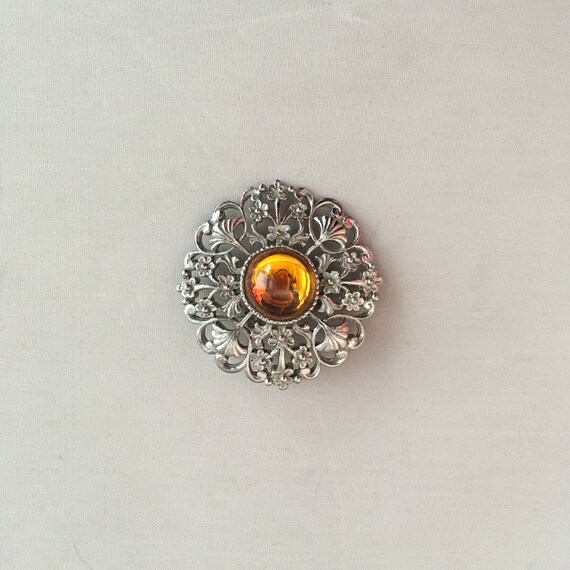 circular brooch