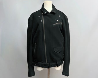 May include: A black biker jacket with a zip fastening, a belt, and several pockets.
