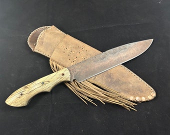 Forged rasp Bowie knife with filework along the spine, with spalted tamarind scales, copper pins, mosaic pin and a custom leather sheath.