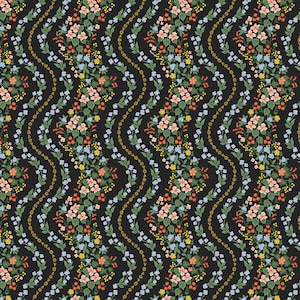 May include: A repeating pattern of colorful flowers and foliage on a black background. The design features clusters of pink, blue, yellow, and orange flowers, with green leaves and stems. Wavy lines of gold dots add a decorative element.