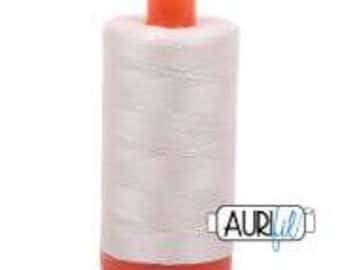 May include: A spool of white thread with an orange top and bottom. The thread is labeled "AURIfil" in a white box with a black border.