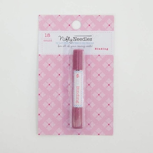 May include: A pink and white packaging with a pink marker labeled "Binding" for sewing projects. The packaging says "Nifty Needles by Lori Holt for all of your sewing needs!" and "18 count".