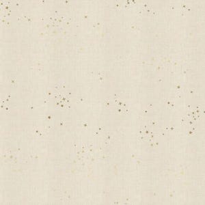 May include: Cream-colored fabric with a subtle crosshatch texture, adorned with scattered gold-colored cross and star-shaped embellishments. The design creates a delicate, celestial pattern, suitable for various craft projects.