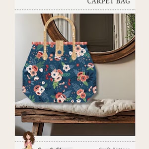 May include: A carpet bag craft pattern #402 featuring a dark blue fabric with a floral print of pink and white flowers and green leaves. The bag has two tan handles and a red plaid trim. The finished size is 14 inches by 4 inches by 11 inches.