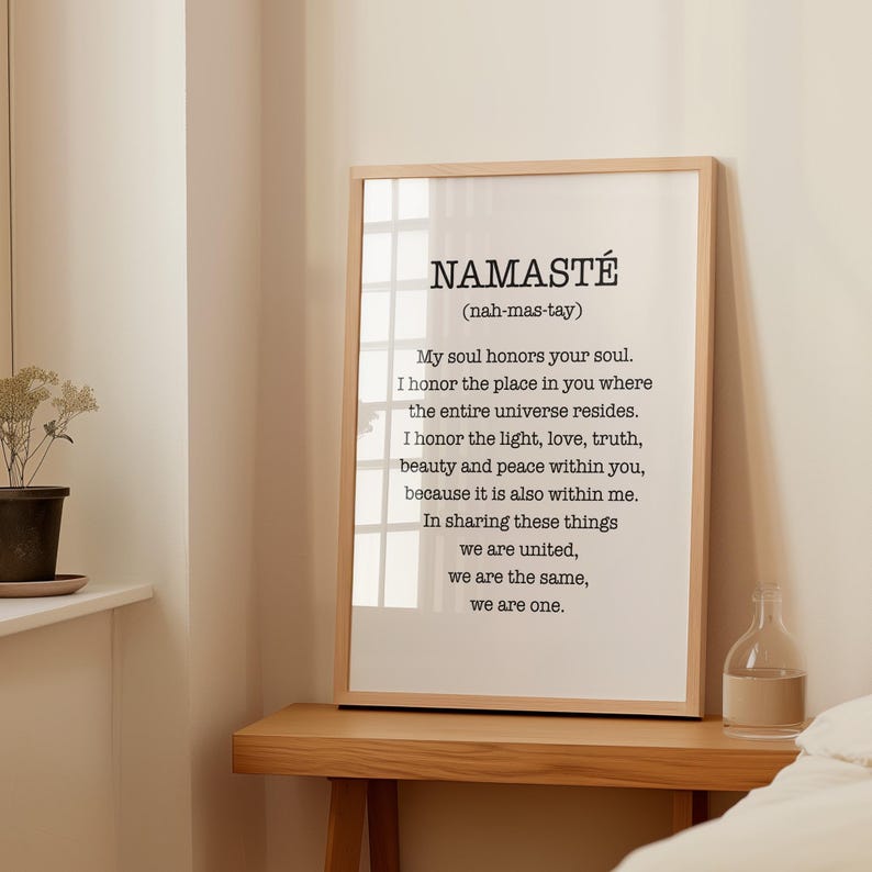 May include: A framed print with a white background and black text. The text reads "NAMAST&Eacute; (nah-mas-tay)" and continues with a quote about honoring the soul and the universe.