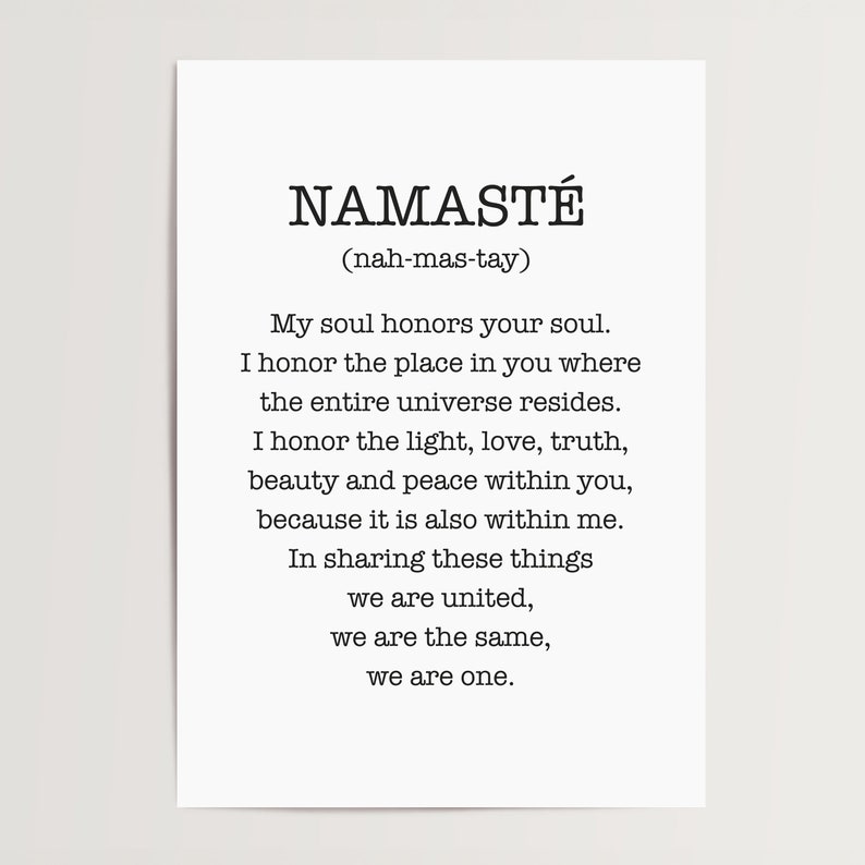 May include: Black and white typography print with the word "Namaste" and its pronunciation in parentheses. The print features a quote about honoring the soul and the universe.