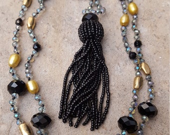 Long and Elegant Champaign and Caviar Shimmering Crystals Golden Pearls Knotted Necklace with Chic Black Beaded Tassel