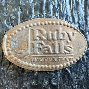 May include: A rustic wooden sign with the text "Welcome to our home" in a handwritten style. The sign features a distressed finish and a simple, inviting design, perfect for a front porch or entryway.