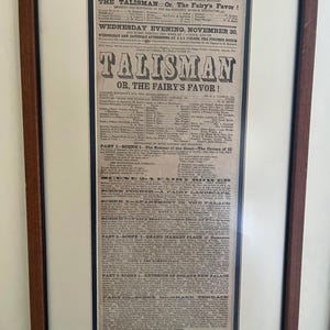 May include: A vintage playbill for a production of "The Talisman" or "The Fairy's Favor" at the Boston Museum. The playbill lists the cast of characters and a detailed description of the scenes, including "The Retreat of the Genii", "The Cavern of III", "A Fairy Land", "Grand Market Place of Damascus", and "Exterior of Codad's New Palace".