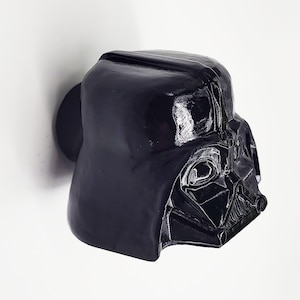 May include: Black plastic Darth Vader head wall hook.