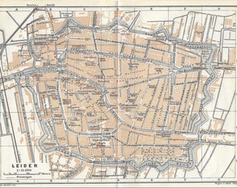 May include: Vintage map of Leiden, Netherlands, with a scale of 1:11,000. The map features a detailed street layout, canals, and labeled landmarks in a sepia tone. The city's name is prominently displayed at the bottom, with a grid overlay.
