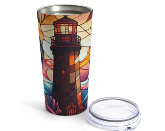 May include: A stainless steel tumbler with a colorful stained glass design of a lighthouse. The tumbler has a lid and is perfect for keeping drinks hot or cold.