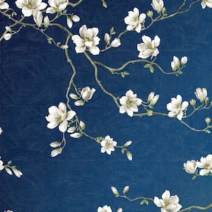 May include: A dark blue background featuring a pattern of white magnolia flowers and branches. The flowers are in bloom and in bud, with green leaves. The branches are a light brown colour.