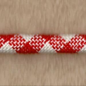 May include: Red and white striped rope with a zig-zag pattern.
