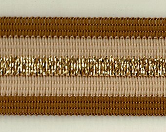 May include: Brown and beige trim with a gold metallic stripe. This trim is perfect for adding a touch of elegance to any project.