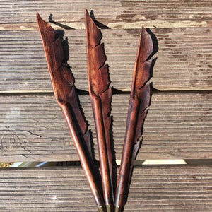 Handcrafted feather-shaped genuine leather pen, matching accessory for our handmade leather journals.
