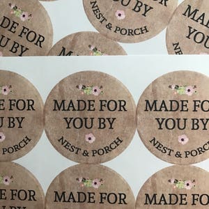 May include: A set of round, brown paper stickers with a floral design and the text "Made for you by Nest & Porch".