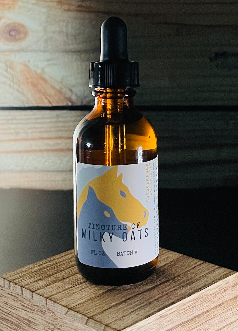 May include: A brown glass bottle with a dropper top, labeled "Tincture of Milky Oats" with a horse illustration. The bottle is 2 fluid ounces and has a batch number.
