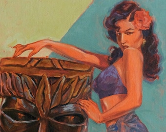 May include: A woman in a purple bikini top and a blue sarong poses with one leg on a carved wooden tiki statue. The statue has a large, angry face and a fire pit in its mouth.
