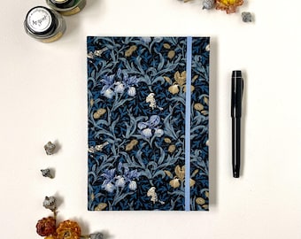 Blue Iris Journal • A5 size • Fabric Covered • William Morris Print • Hardback Cover • 192 Ruled Pages • Elastic Closure • Inner Pocket