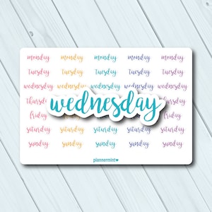 May include: A sticker sheet featuring the days of the week in a handwritten font. The word "wednesday" is highlighted in a teal color. Other days are in various colors, including pink, yellow, and purple.