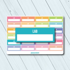 May include: A sticker sheet with colorful rectangular labels. Each label has the word "LAB" printed at the top, with a blank space below. A larger teal label with "LAB" is on top. The brand name "plannermint" is at the bottom.