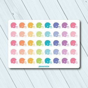 May include: A sheet of football helmet stickers in a variety of colours, including pink, orange, yellow, green, teal, blue, and purple. The stickers are arranged in rows and columns on a white background. The text "plannermint" is at the bottom.