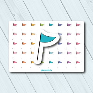 May include: A sticker sheet featuring a repeating pattern of small, colorful flag illustrations. A larger, turquoise flag sticker is overlaid on the sheet. The text "plannermint" is printed in the lower right corner.